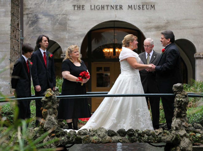 Victoria Relvintas and Jonathan Neuenschwander pose for photos in the Lightner Museum courtyard after being wed at 12:12 p.m. on Wednesday, Dec. 12, 2012. By DARON DEAN, daron.dean@staugustine.com