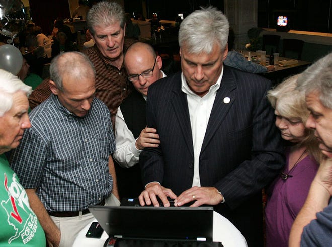 A crowd gathers around a computer as election results come in at Ebro Greyhound Park in January when Washington County voters authorized slot machines. State officials blocked the addition of slot machines, saying legislative approval is needed.