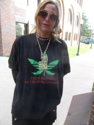 Medical marijuana activist Colleen Begley stands outside the Burlington County Courthouse. She pleaded guilty to eluding police as she fled with two pounds of marijuana in her vehicle.