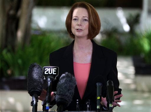 FILE - In this Nov. 9, 2012 photo, Australian Prime Minister Julia Gillard talks to media in Bali, Indonesia. Leaders of two of the closest longtime allies of the United States have been quick to express sympathy over a shooting rampage that left 26 people dead, including 20 children, at a Connecticut elementary school. Gillard said in a statement Saturday that her country shares America's shock at what she called "this senseless and incomprehensible act of evil."
