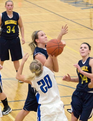 Hillsdale's Hayley Maystead gets fouled on her way to the hoop on Friday night. Jim Drews Photo