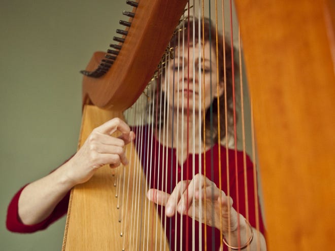 Harpist Aine Minogue performs at The Old Ship Coffee House in Hingham.