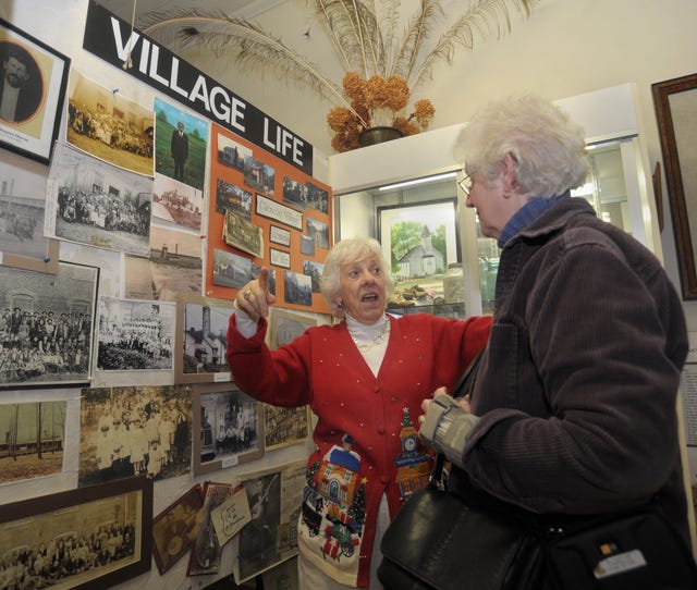 Jerrie Nall (left) talks with Jewel Clark about the Textile Heritage Museum.