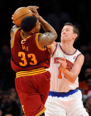 The New York Knicks' Steve Novak blocks a shot by the Cleveland Cavaliers' Alonzo Gee during the second quarter of Saturday's game at Madison Square Garden in New York.