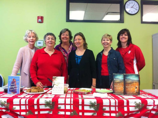 At the holiday book club gathering were, from left: Lynn McClure, Donna Blair, Mary Jeanne Hellings, Susan Murphy, Charlene Petersen and Dawn Barbarine, Y wellness associate. Contributed photo.