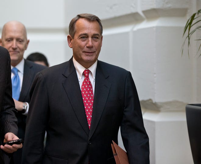 Speaker of the House John Boehner, R-Ohio, arrives for a closed-door meeting with House Republicans as he negotiates with President Obama to avert the fiscal cliff, at the Capitol in Washington, Tuesday, Dec. 18, 2012.  (AP Photo/J. Scott Applewhite)