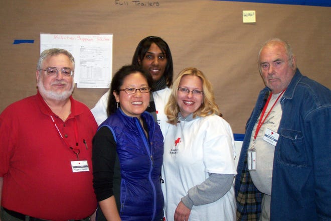 Roger Kessler, left, of South Bristol, is pictured with other volunteers during his deployment to Jersey City, N.J., with the American Red Cross to help with superstorm Sandy relief efforts.