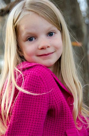 This 2012 photo provided by the family shows Emilie Alice Parker. Parker was killed Friday, Dec. 14, 2012, when a gunman opened fire at Sandy Hook elementary school in Newtown, Conn., killing 26 children and adults at the school. (AP Photo/Courtesy of the Parker Family)