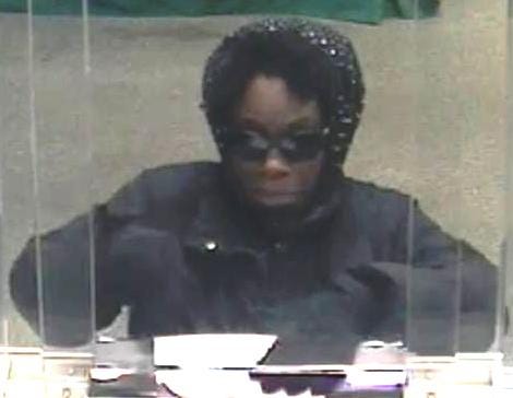 A security camera photo of a wo,man wanted for robbing the Citizens Bank in Milton Village at about noon Monday, Dec. 17, 2012.