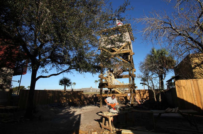 John Frary cuts a piece of wood while putting the finish touches on n interpretation of a 170th century watchtower at the Colonial Quarter on Tuesday afternoon, Dec 18, 2012. The attraction will open in the Spring of 2013. By DARON DEAN, daron.dean@staugustine.com