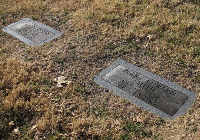 The bodies of Perry Edward Smith, whose grave is seen on the right, and Richard Eugene Hickock were exhumed Tuesday from a sloping hillside at the Mount Muncie Cemetery in Lansing.