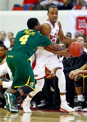 N.C. State’s Lorenzo Brown, shown here working against Norfolk State’s Marese Phelps, left, is coming off a 16-point, seven-assist outing.