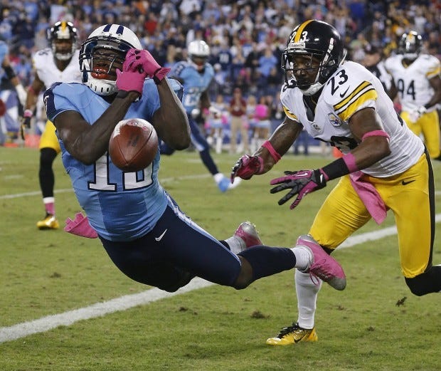 Tennessee wide receiver Kendall Wright (13) can't make a catch as Steelers cornerback Keenan Lewis (23) defends during the first half Thursday in Nashville, Tenn.