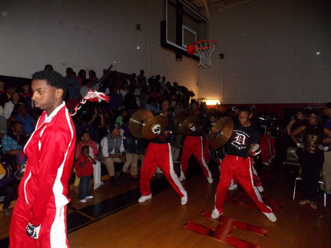 The DHS band, led my drum major Ronald Comeaux, comes out to battle song-for-song with Lutcher High’s band at the DHS gym last Saturday.