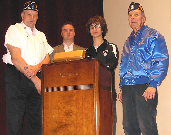 Noah Marrero, a sophomore at West Canada Valley Central School and a contestant in the American Legion High School Oratorical Scholarship Program, prepares to present his speech on the U.S. Constitution on Friday. From left are Commander Les Crossett, of American Legion Post No. 1524, Newport, which is sponsoring Marrero; Adam Kujawski, American Legion member; Marrero and Ed Falk, American Legion member.