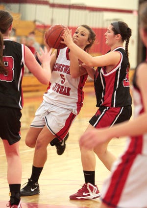 Whitman-Hanson's Krissy Allen, right, moves in to defend against Bridgewater-Raynham's Valerie Hoyle during a high school basketball game in Bridgewater on Tuesday, Dec. 18, 2012.