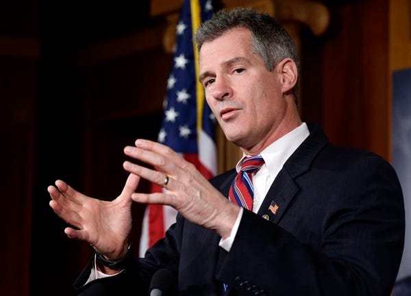 Sen. Scott Brown, R-Mass., speaks during a media availability, on Capitol Hill Tuesday, Nov. 13, 2012, in Washington.