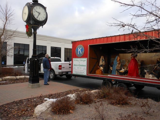 Members of the Cheboygan Kiwanis Club prepare to set their nativity scene up at its new location Wednesday. The group moved the display to the parking lot of Citizens National Bank after city council voted Tuesday night to ban all private displays on city-owned property until a policy could be adopted.