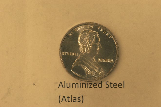This undated photo provided on Wednesday, Dec. 19, 2012 by the U.S. Mint in Philadelphia shows is a bonneted Martha Washington on a nonsense test piece. The Mint has been testing different materials to find less expensive ways to make coins. (AP Photo/U.S. Mint)