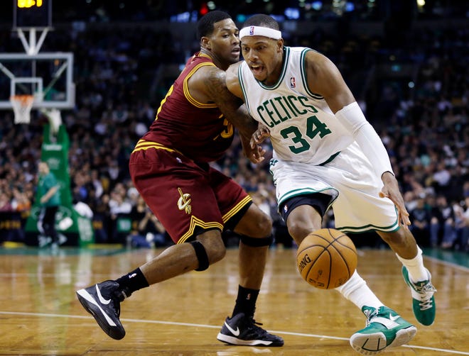 Celtics forward Paul Pierce (right) drives to the basket for two of his 40 points in Boston's 103-91 win over the Cavaliers on Wednesday night.