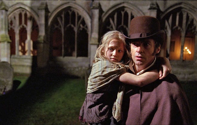 The Hollywood adpatation of the Broadway musical "Les Miserables" is one of four movies opening Christmas Day at the Hollywood 14 theaters in Topeka. Pictured are Hugh Jackman as Jean Valjean holding Isabelle Allen as Young Cosette.