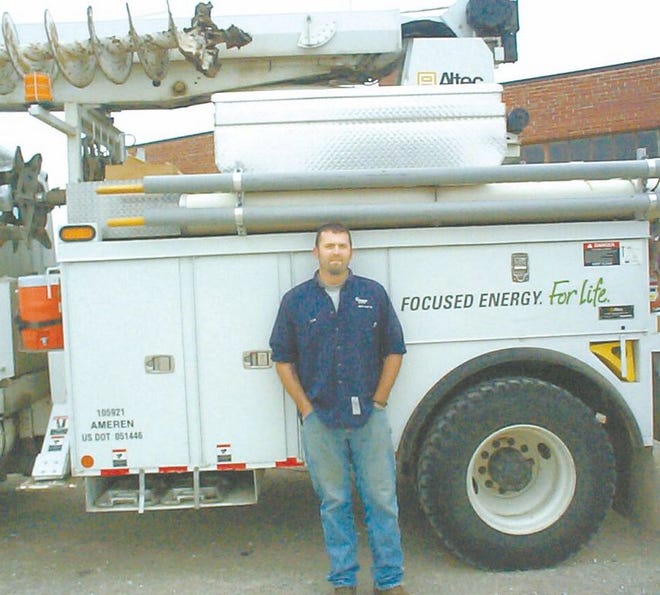 Cole Danner of Canton stands near one of the line trucks he works with as an apprentice lineman for Ameren Illinois utility company. Danner was hired by the company after serving in an infantry division of the U.S. Army. The leadership, teamwork and communication skills he learned in the military apply well to his job in civilian life. Ameren has been recognized nationally for hiring military veterans.