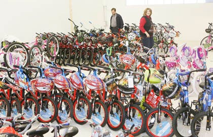 John Kerr and wife Leslie Kerr browse through bicycles at Christmas Cheer in Jacksonville.
