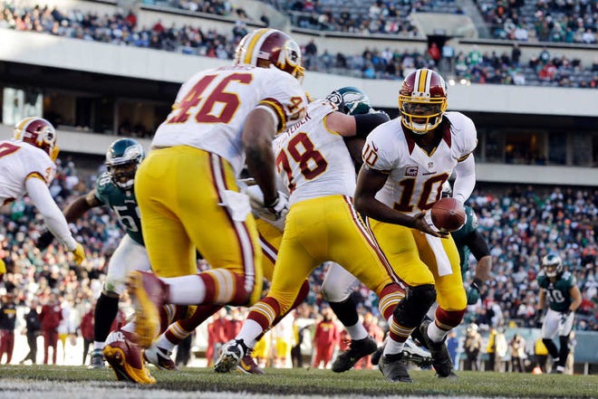 Washington Redskins' Robert Griffin III in action in the second half of an NFL football game against the Philadelphia Eagles, Sunday, Dec. 23, 2012, in Philadelphia. (AP Photo/Mel Evans)
