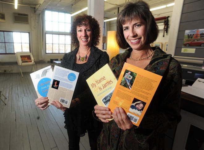 Damianos Publishing owner Lynne Damianos, right, and Graphic Designer Lisa Thompson display two of the company's new books in Framingham.
