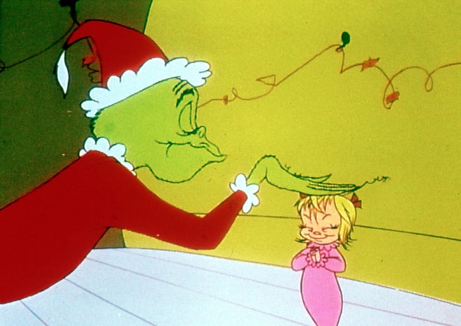 The Grinch and Cindy Lou Who in "How the Grinch Stole Christmas."