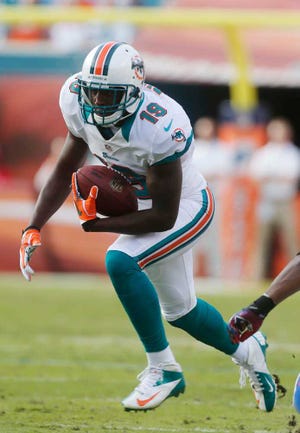 Miami Dolphins wide receiver Armon Binns runs with the ball Sunday during the second half against the Buffalo Bills.