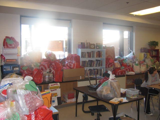 Piles of gifts at Robert Adams Middle School in Holliston. Seventh-graders raised money to buy gifts for underprivileged children through Project Just Because.
CONTRIBUTED PHOTO