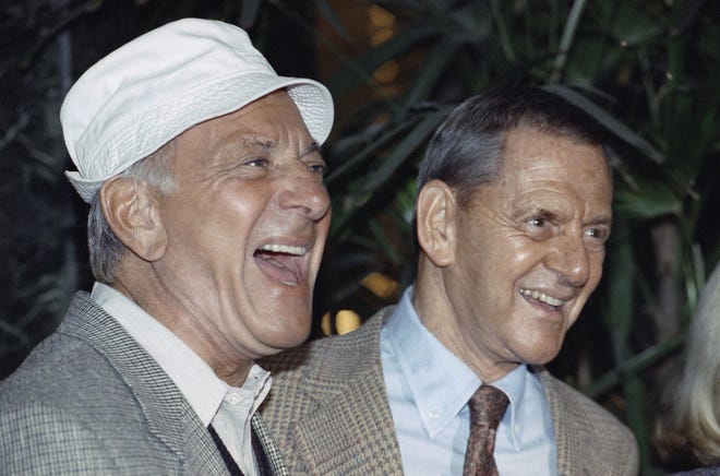 Jack Klugman, left, and Tony Randall laugh at a news conference announcing they were going to reprise their roles as Oscar Madison and Felix Unger for a one-night benefit performance of Neil Simon's play, "The Odd Couple," in Beverly Hills, Calif.