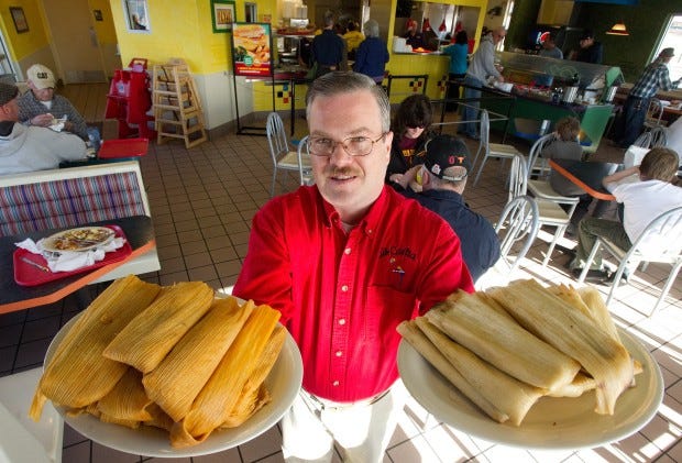 La Casita area manager Michael Brennan shows off some the tamales the mexican eatery sells. Since opening Dec. 12, Brennan says La Casita has sold about 100 tamales a day. Photo by Mike Sweeney
