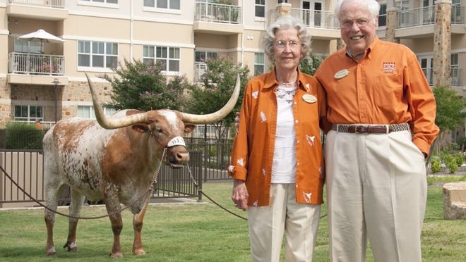 John and Charlotte Henderson with Bevo.