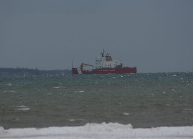 The U.S. Coast Guard cutter Mackinaw anchored at the mouth of the Cheboygan River Sunday, waiting for high wings to abate before returning to port at the Millard D. Olds Memorial Moorings. The ship was in Mackinaw City, among other locations, and available for duty while last week’s blizzard hit Northern Michigan.