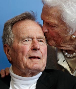FILE - In a Tuesday, June 12, 2012 file photo, former President George H.W. Bush, and his wife former first lady Barbara Bush, arrive for the premiere of HBO's new documentary on his life near the family compound in Kennebunkport, Maine. Former President Bush has been hospitalized for about a week in Houston for treatment of a lingering cough. Bush's chief of staff, Jean Becker, says the 88-year-old former president is being treated for bronchitis at Houston's Methodist Hospital and is expected to be released by the weekend. He was admitted Friday, Nov. 23, 2012. (AP Photo/Charles Krupa, File)