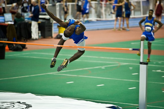 Norwood senior Jason Matovu competes in the high jump during the Bay State Conference indoor track meet at the Reggie Lewis Center in Boston, on Thursday, December 20, 2012.