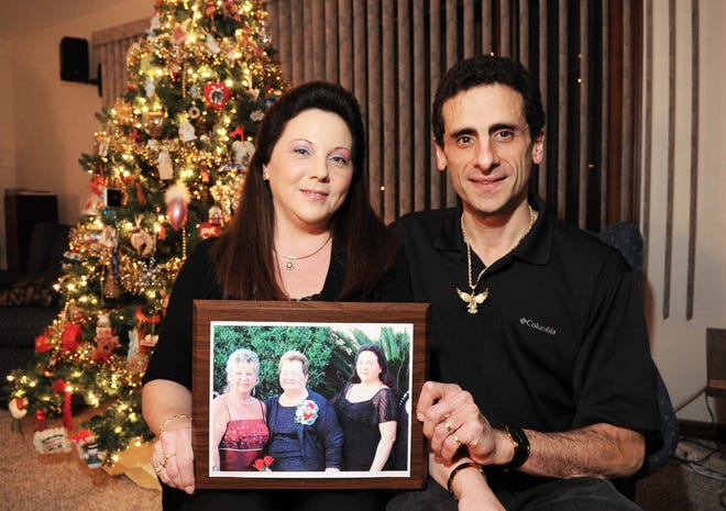 Denise and Jonathan Parker of Easton hold a picture of Denise, with her mother, Margaret Kent, and sister, Donna Sjostedt.