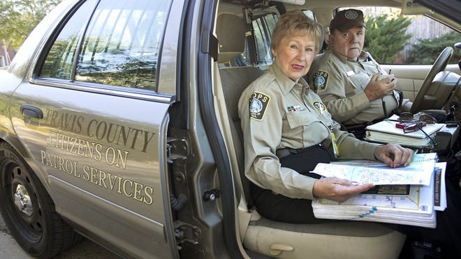 Margo Ball and her partner H. “Hans? Mertens are very active in the Travis County Sheriffs Department Citizens on Patrol program. The dynamic duo, here patrolling the Steiner Ranch neighborhood in far north west Austin, operate out of a retired police cruiser for two shifts a week and cover the county to help with traffic and minor reports.
