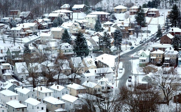 Wednesday's snow covers the landscape of homes in Leetsdale. More snow is headed toward Beaver County this weekend.