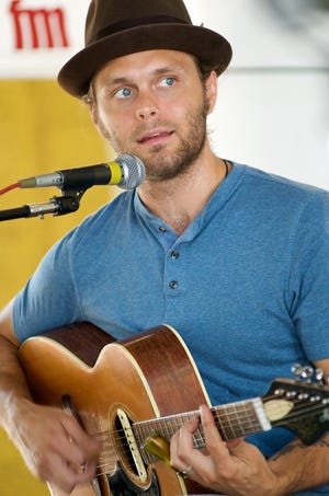 Noah Earle performs during a show at the Tower Grove Farmers’ Market in St. Louis.