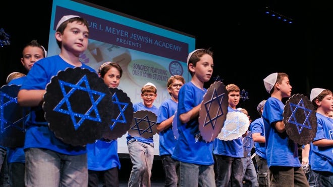 Fourth-graders at Arthur I. Meyer Jewish Academy were among the performers at the school’s second annual Hanukkah Zimriyah (Songfest). The middle school band, directed by Asis Reyes, accompanied the student singers.