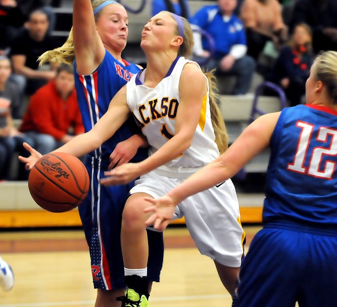 Jackson's Grace Landrie draws a foul on her drive against Revere during the 2012 jackson Girls Holiday Classic.