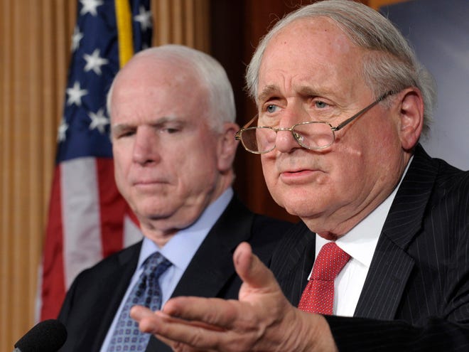 Senate Armed Services Committee Chairman Sen. Carl Levin, D-Mich., right, accompanied by the committee's ranking Republican, Sen. John McCain, R-Ariz., gestures during a news conference on Capitol Hill in Washington, Friday, Dec. 28, 2012, to discuss changes in Senate procedural rules. (AP Photo/Susan Walsh)
