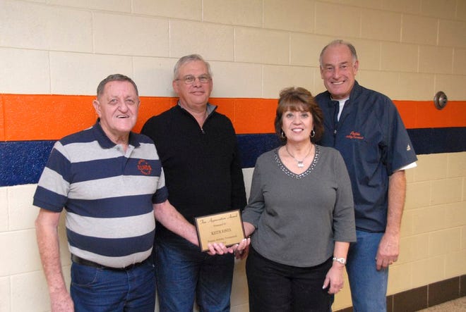 The 2012 Pontiac Holiday Tournament Fan Appreciation Award winners received recognition for their continued support of the tournament on Thursday from Tournament Director Jim Drengwitz. From left are winners Keith Jones, Doug Zick and Linda Zick and Drengwitz.
