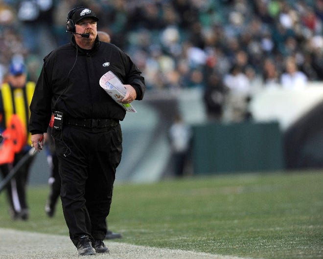 Philadelphia Eagles coach Andy Reid walks along the sideline in the second half of an NFL football game against the Washington Redskins, Sunday, Dec. 23, 2012, in Philadelphia. (AP Photo/Michael Perez)