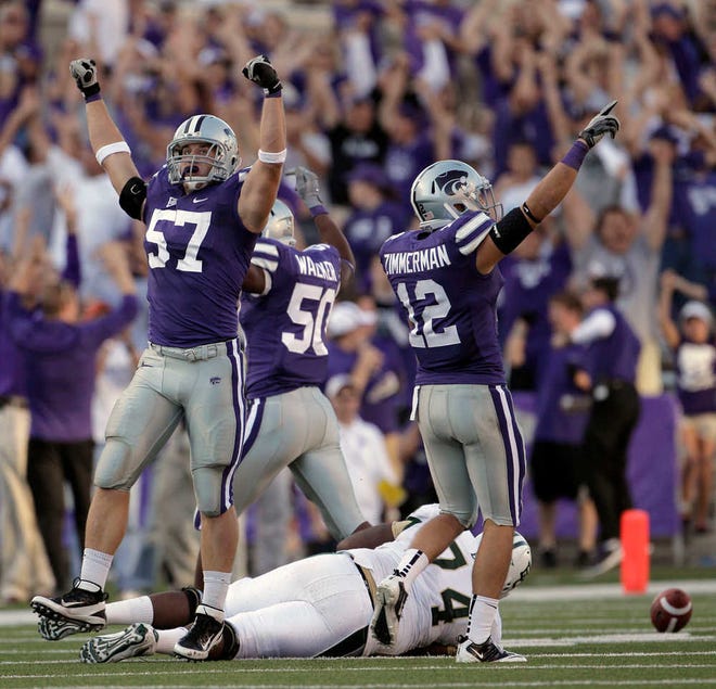 Kansas State defensive back Ty Zimmerman (12) celebrates a Wildcat victory after a game-winning play.