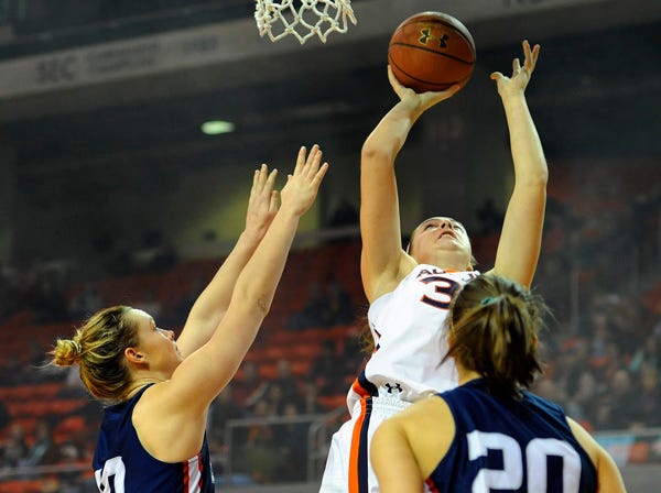 Auburn's Peyton Davis shoots over Samford's Taylor Reece, left, and Shelby Campbell during the first half of Saturday's game in Auburn. (Anthony G. Hall | Auburn University)
