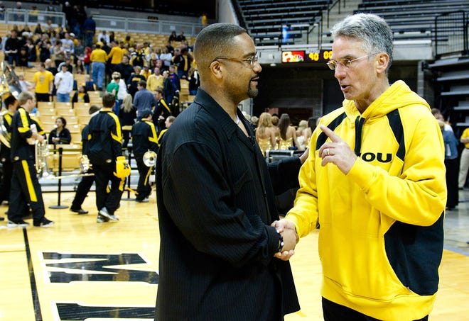 Missouri Athletic Director Mike Alden, right, speaks to Coach Frank Haith after last season’s NCAA Tournament selection show.